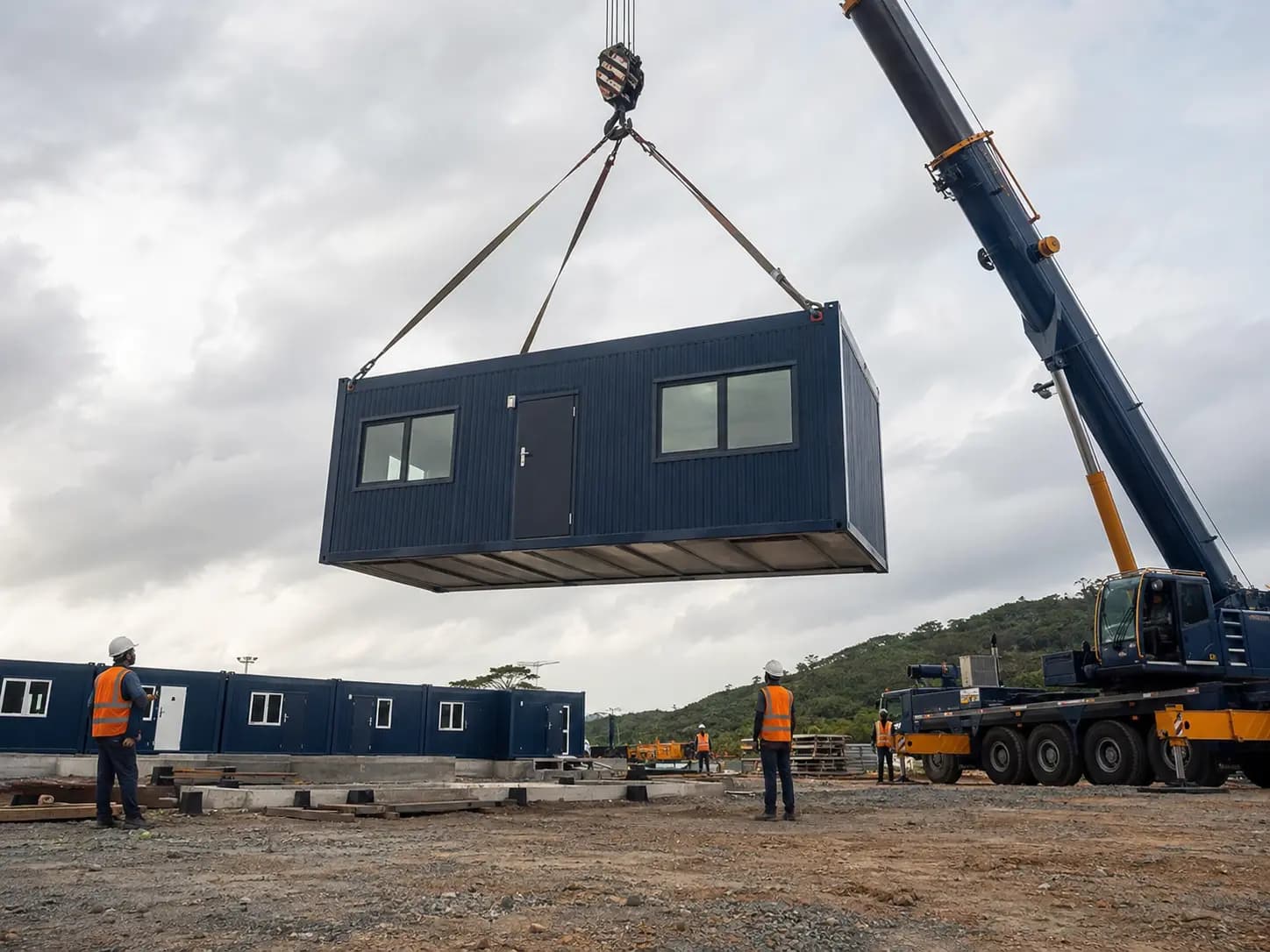 Prefabricated module being installed by crane on a professional site